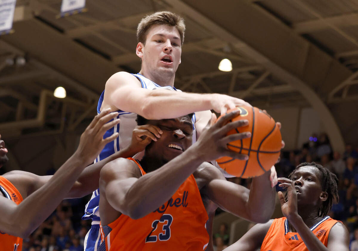 Duke’s Kyle Filipowski (30) fights for the rebound with Bucknell’s Pip Ajayi (23) during the first half of Duke’s game against Bucknell at Cameron Indoor Stadium in Durham, N.C., Friday, Nov. 17, 2023.