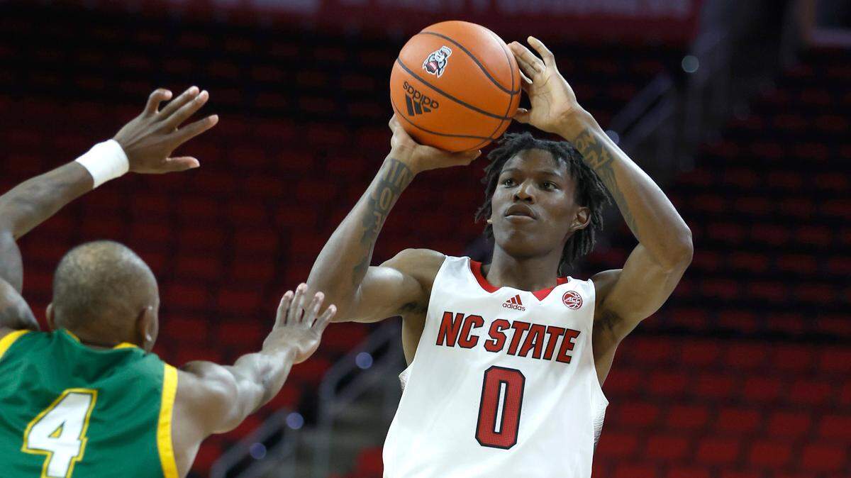 N.C. State’s Terquavion Smith (0) shoots as Lees-McRae’s LJ Rogers (4) defends during the second half of N.C. State’s 107-59 victory over Lees-McRae in an exhibition game at PNC Arena in Raleigh, N.C. Wednesday, Nov. 2, 2022.