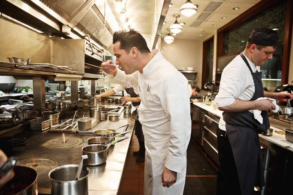 Herons’ executive chef Steven Devereaux Greene, tastes everything before dinner service begins at the Cary restaurant on Tuesday, Jan. 18, 2019.