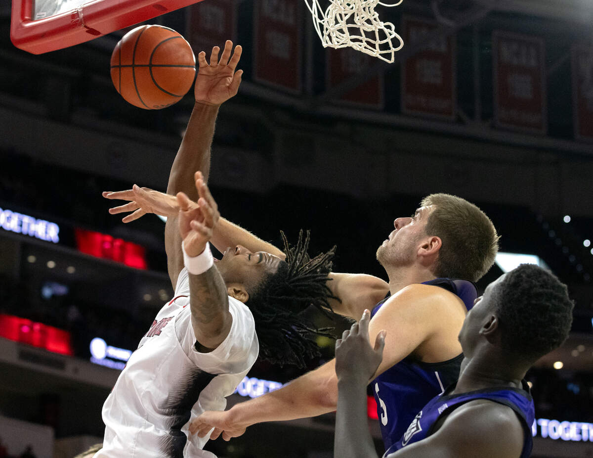 N.C. State’s Jayden Taylor drives to the basket against Abilene Christian’s Cameron Steele during the first half of the Wolfpack’s game on Friday, Nov. 10, 2023, at PNC Arena in Raleigh, N.C.