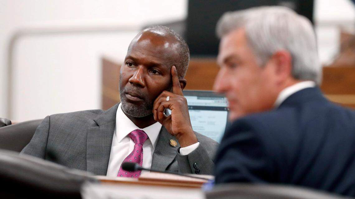 Sen. Ben Clark, left, and Sen. Kirk deViere listen to a speaker during a meeting of the Senate Finance Committee in Raleigh, N.C., Wednesday, June 30, 2021.