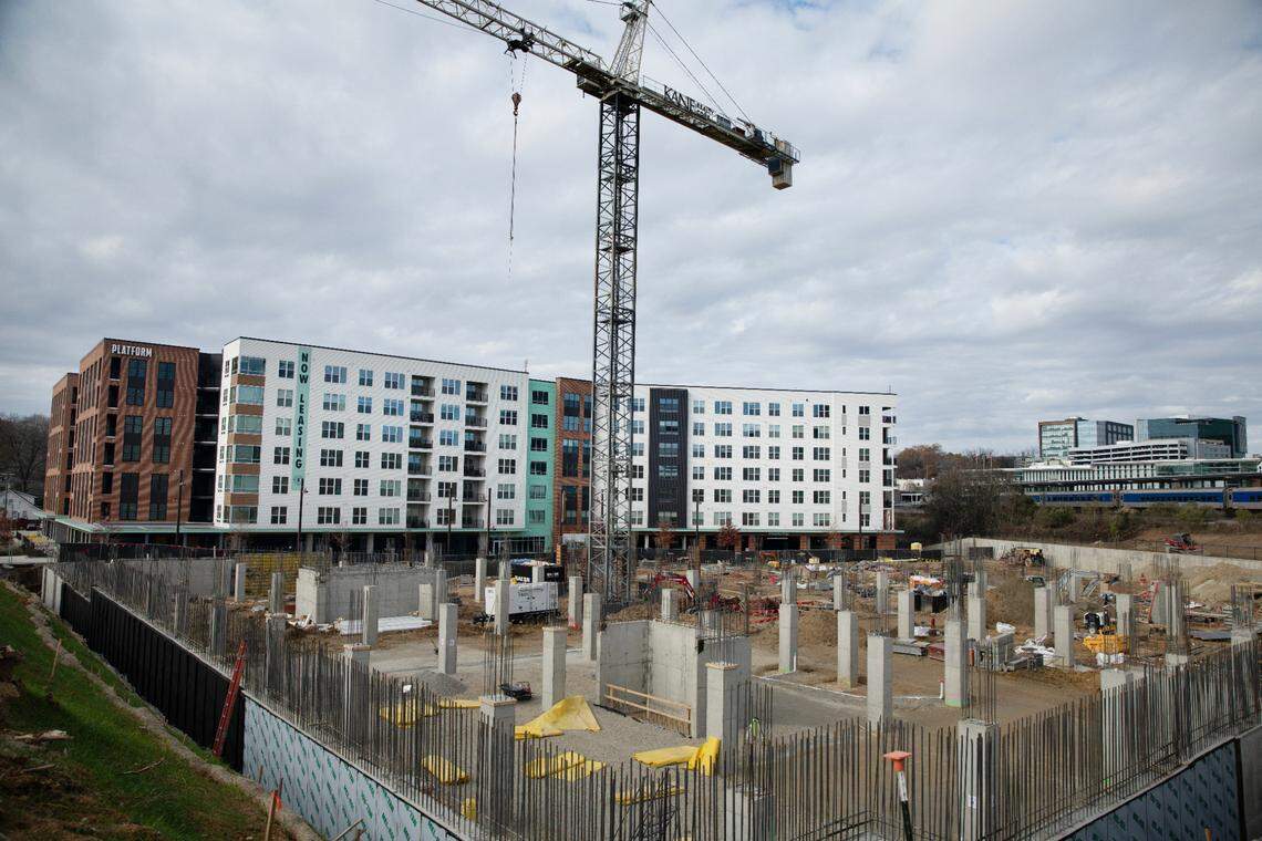 Oldham & Worth (foreground), broke ground a few months ago beside Platform. It will be five stories of upscale apartments on six acres at the intersection of West Cabarrus and South West streets.