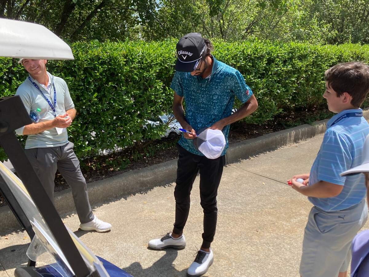 Akshay Bhatia of Wake Forest signs autographs after this round Saturday, June 4, 2022 in the Rex Hospital Open in Raleigh.