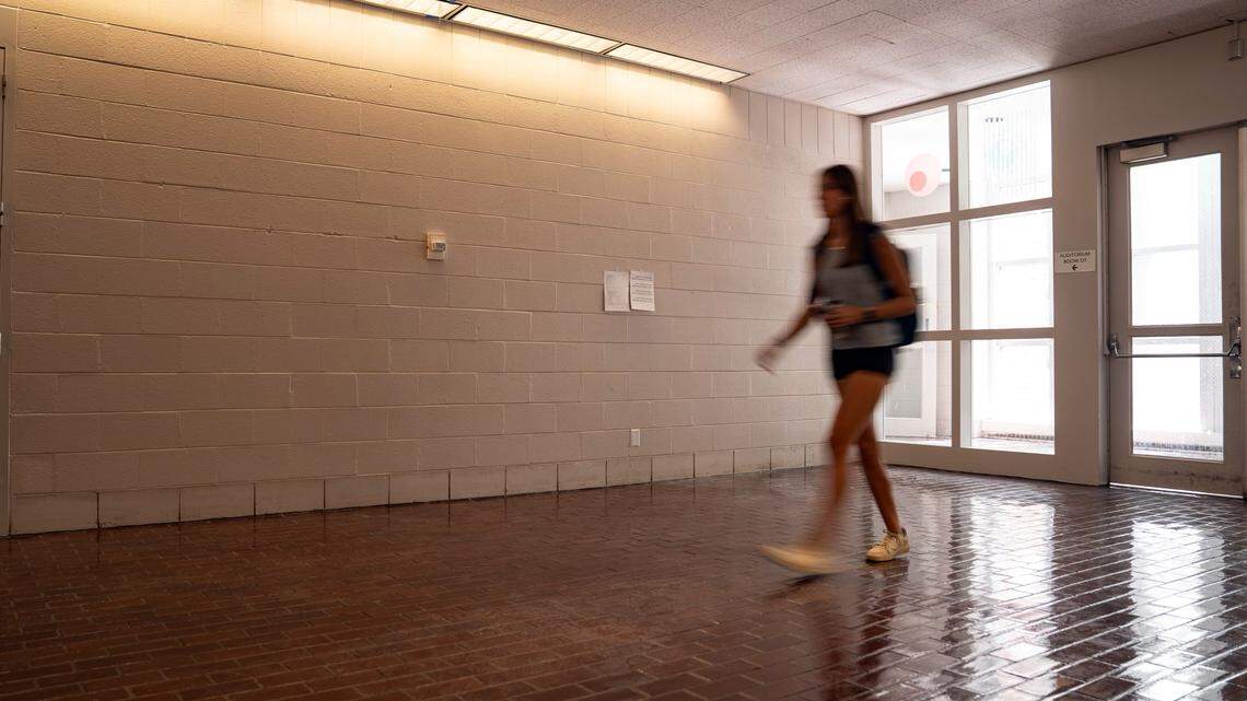 A student walks by the wall space previously occupied by a mural of hand-carved linoleum prints remembering UNC-Chapel Hill’s pro-Palestinian encampment on April 26, 2024.
