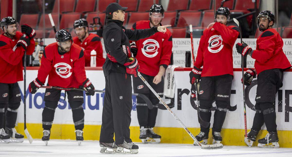 Carolina Hurricanes coach Rod Brind’Amour talks with his players during practice on Tuesday, May 12, 2026, at Lenovo Center in Raleigh, N.C.