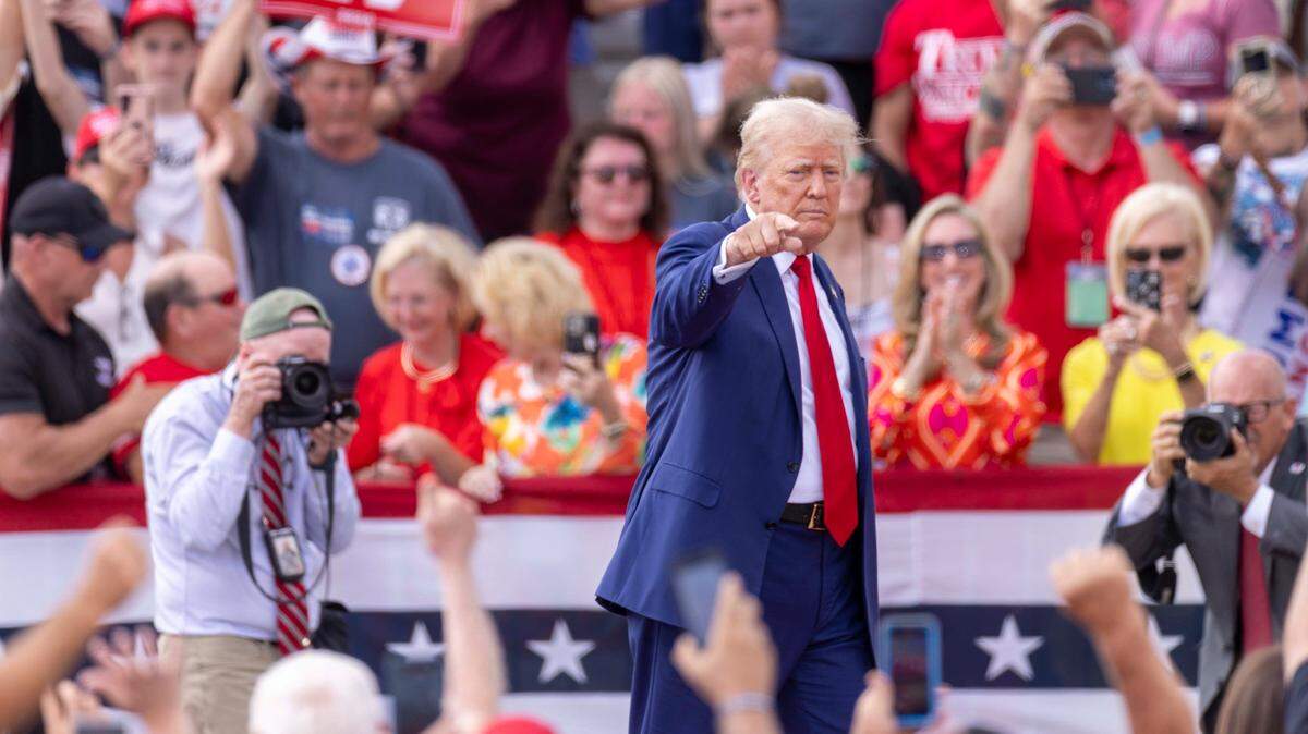 Former President Donald Trump acknowledges supporters during a rally at the North Carolina Aviation Museum & Hall of Fame in Asheboro, NC on Wednesday, Aug. 21, 2024.