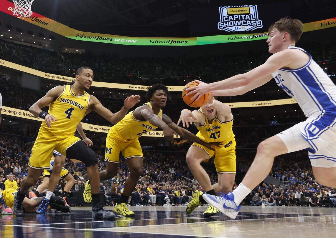 Duke’s Nikolas Khamenia (14) tracks down a loose ball before Michigan defenders can get to it during Duke’s 68-63 victory over Michigan in the Capital Showcase at Capital One Arena in Washington, D.C., Saturday, Feb. 21, 2026.