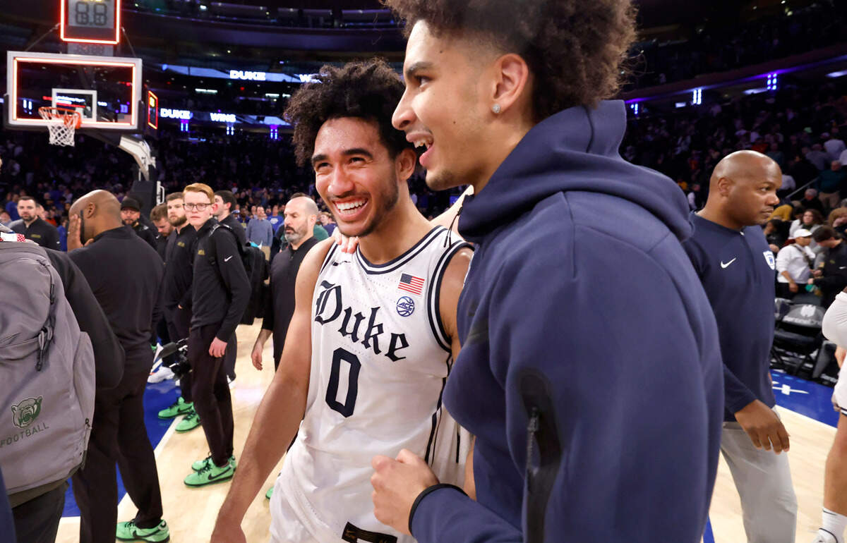 Duke’s Tyrese Proctor celebrates with Jared McCain (0) after the Blue Devils’ 78-70 victory over Baylor at Madison Square Garden in New York City Wednesday, Dec. 20, 2023.