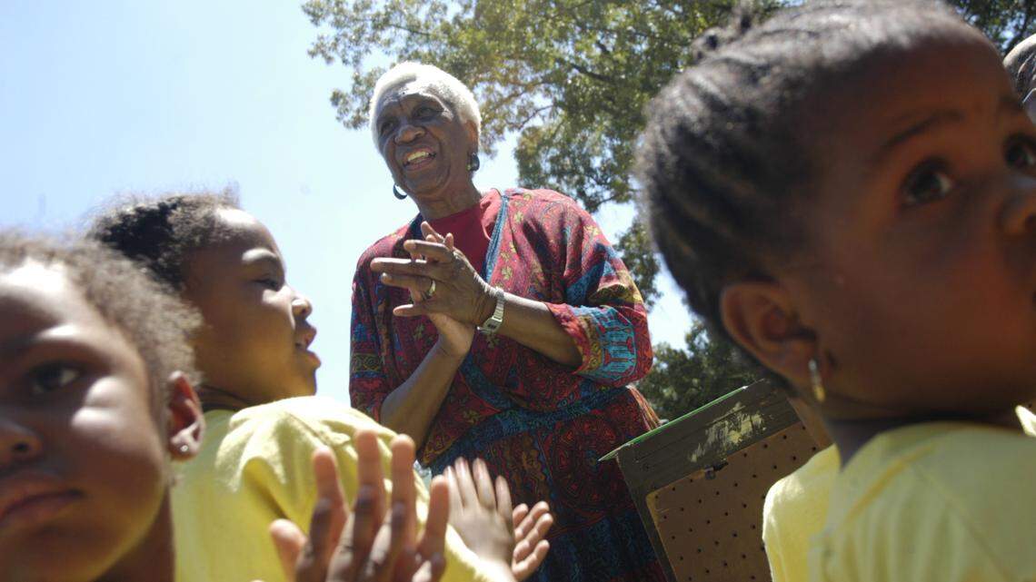 MURRAY1.NE.080704.ASR Margaret Rose Murray, center, leads her preschool students in the spiritual hymn ‘This Little Light of Mine’ during a celebration to mark the 40th anniversary of her school The Vital Link. At age 73 she still has boundless energy and enthusiasm for her work in educating kids. “It’s been a blessing to be able to do teach the children for all these years, “ she said radiating a smile that has grown wider as the years have gone by.