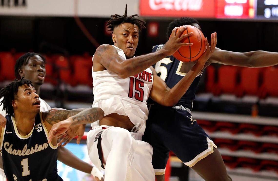 N.C. State’s Manny Bates (15) pulls in the rebound during the second half of N.C. State’s 95-61 victory over Charleston Southern in the Wolfpack Invitational at Reynolds Coliseum in Raleigh, N.C., Wednesday, Nov. 25, 2020.