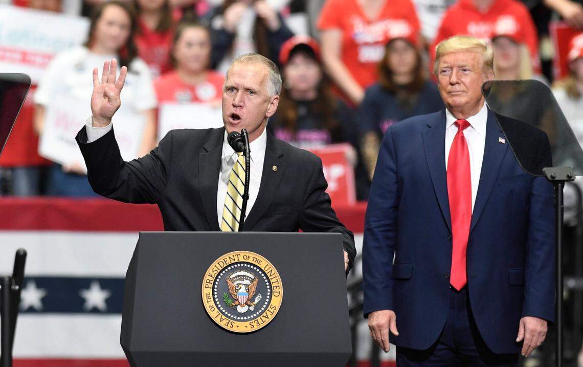 President Donald J. Trump listens as U.S. Senator Thom Tillis of North Carolina addresses supporters during a rally at Bojangles Arena in Charlotte, in March 2020