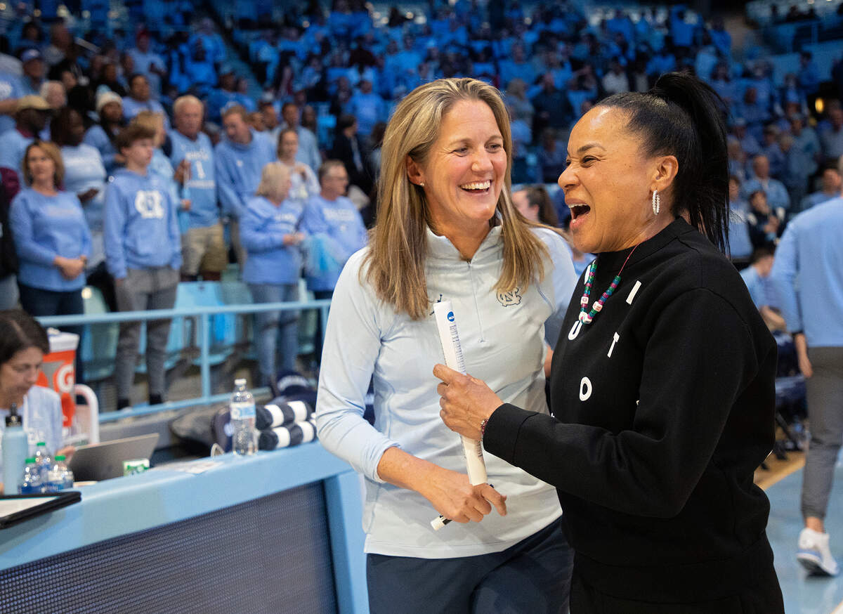 North Carolina head coach Courtney Banghart and South Carolina head coach Dawn Staley speak prior to the Tar Heels’ game on Thursday, Nov. 30, 2023, at Carmichael Arena in Chapel Hill, N.C.