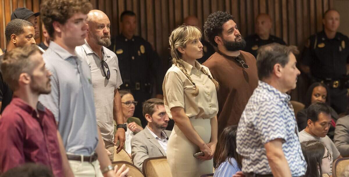 Samantha Walter, center, from Split Raleigh, a bar and lounge located at 403 Glenwood Avenue, stands as she and other business owners are recognized by Raleigh Police Chief Rico Boyce, during his remarks to the Raleigh City Council on Tuesday, July 7, 2026 in Raleigh, N.C.