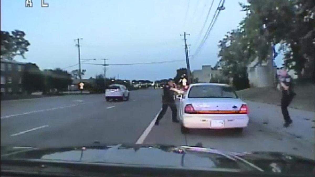 In this image made from July 6, 2016, video captured by a camera in the squad car of St. Anthony Police officer Jeronimo Yanez, the Minnesota police officer shoots at Philando Castile in the vehicle during a traffic stop in Falcon Heights, Minn. Yanez’s backup officer Joseph Kauser is seen standing on the passenger side of the vehicle. The video was made public by the Minnesota Bureau of Criminal Apprehension and the Ramsey County Attorney’s Office, Tuesday, June 20, 2017, just days after the officer was acquitted on all counts in the case.