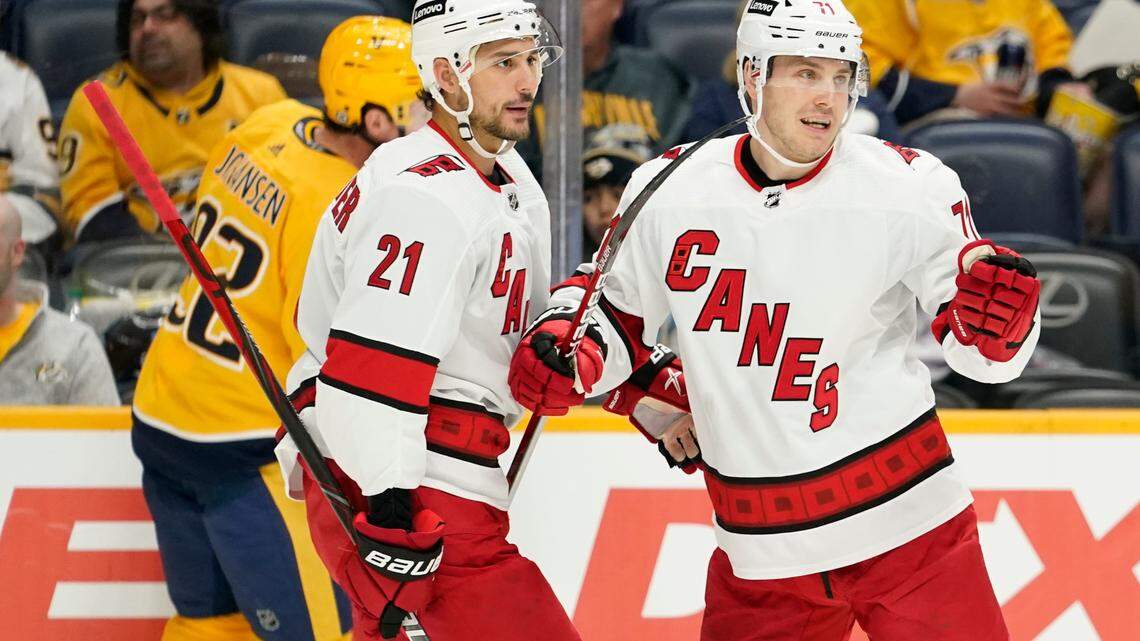 Carolina Hurricanes right wing Jesper Fast (71) celebrates with Nino Niederreiter (21) after Fast scored a goal against the Nashville Predators in the first period of an NHL hockey game Saturday, Oct. 16, 2021, in Nashville, Tenn. (AP Photo/Mark Humphrey)