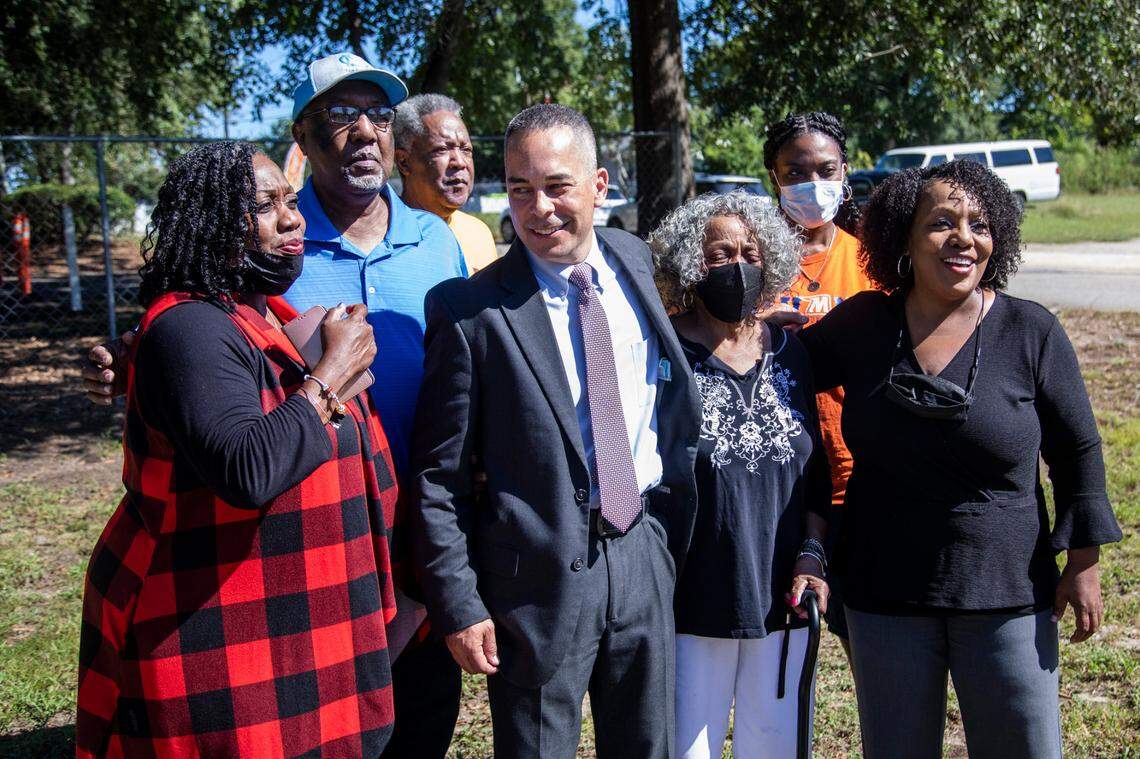 Family members of Alma Jones gather around Raleigh Police Detective Jerry Faulk following a press conference Thursday, Sept. 23, 2021 near the site in Raleigh where 77-year-old Jones was raped and murdered in 1977. Police say investigators solved the 44-year old case and Jones was killed by Paul Crowder, who died in 2015 at 72.