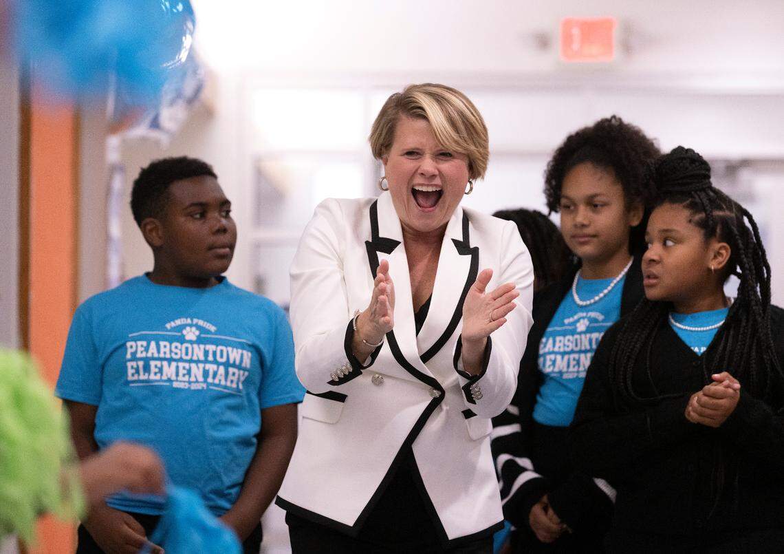 Catherine Truitt, North Carolina superintendent of public instruction, reacts as she is greeted by students at Pearsontown Elementary School on Friday, Nov. 3, 2023, in Durham, N.C. Truitt attended a ceremony during which Pearsontown Elementary School Principal Asia Cunningham was honored with a Milken Educator Award.
