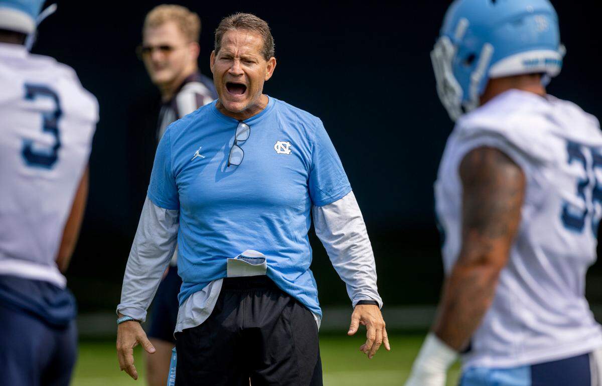 North Carolina assistant head coach for defensive Gene Chizik works with the defensive unit during the Tar Heels’ first practice of the season on Wednesday, August 2, 2023 in Chapel Hill, N.C.
