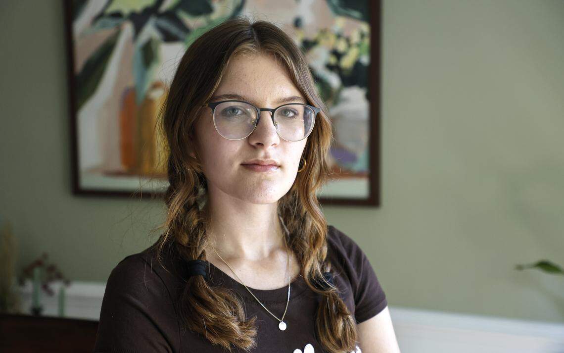Eleanor Canina poses in her home in Cary Wednesday, April 22, 2026. After an English teacher failed her for allegedly using AI to complete a writing assignment, the Green Hope High freshman and her mother are challenging AI detectors, urging Wake County to stop relying on tools that produce false positives.