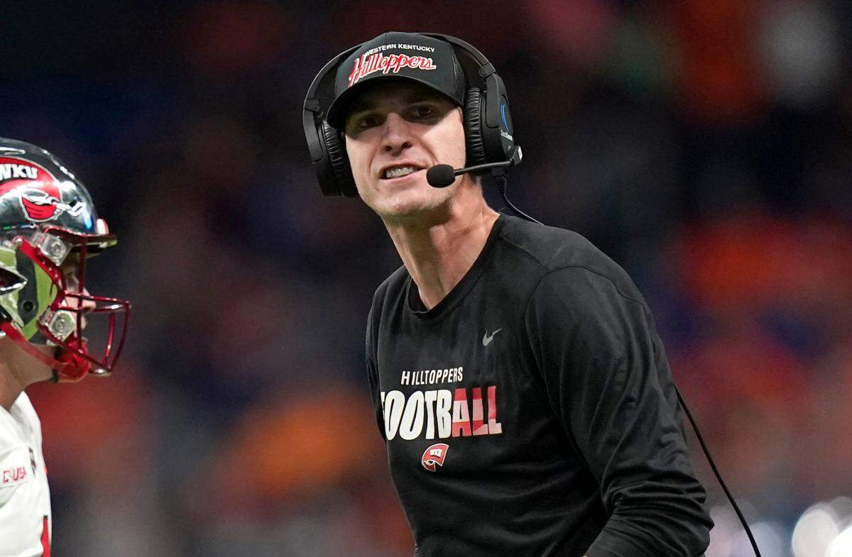 In this file photo Western Kentucky offensive coordinator Zach Kittley reacts to a play during the Conference USA Championship against UTSA, Friday, Dec. 3, 2021, in San Antonio.