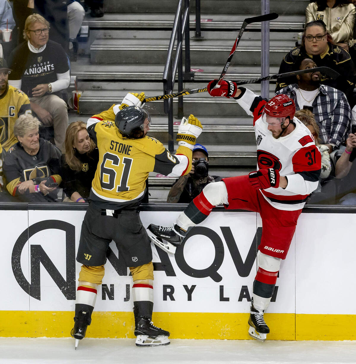Carolina Hurricanes right wing Andrei Svechnikov (37) is checked into the boards by Vegas Mark Stone (61) right wing Mark Stone (61) in the first period in Game 3 of the Stanley Cup Final, on Saturday, June 6, 2026 at T-Mobile Arena in Las Vegas, NV.