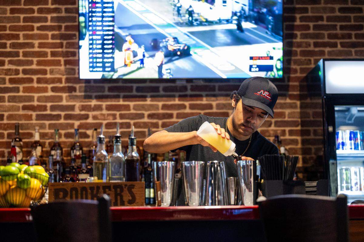 The craft cocktail bar at Apex Racing Lab features vodkas and a growing bourbon and tequila collection. Drinks are named for drivers including Michael Waltrip and Dale Earnhardt.