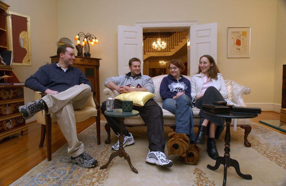 A 2002 photo shows the Peterson children at their father’s Forest Hills home in Durham. From left: Clayton Peterson, Todd Peterson, Martha Ratliff and Margaret Ratliff.