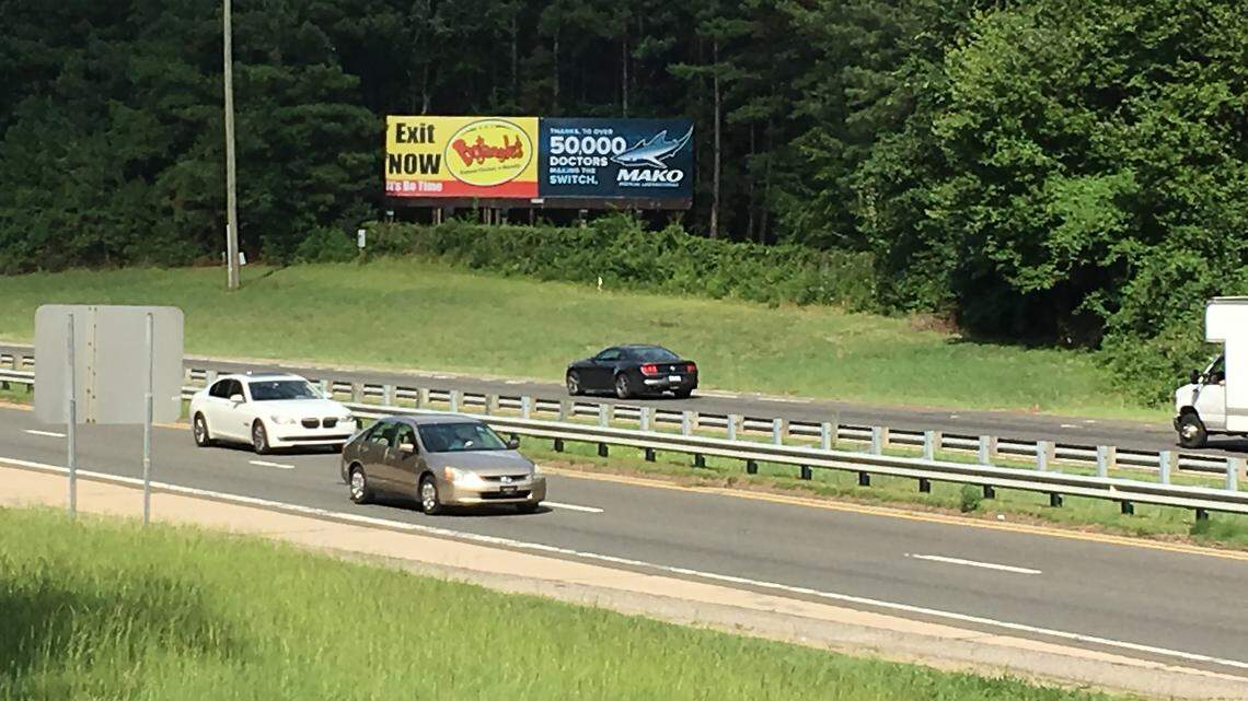 A bill vetoed by Gov. Roy Cooper on Thursday would have allowed the owner of this billboard along the Raleigh Beltline to move it up to two miles away if the N.C. Department of Transportation takes the property during the upcoming widening of the highway.