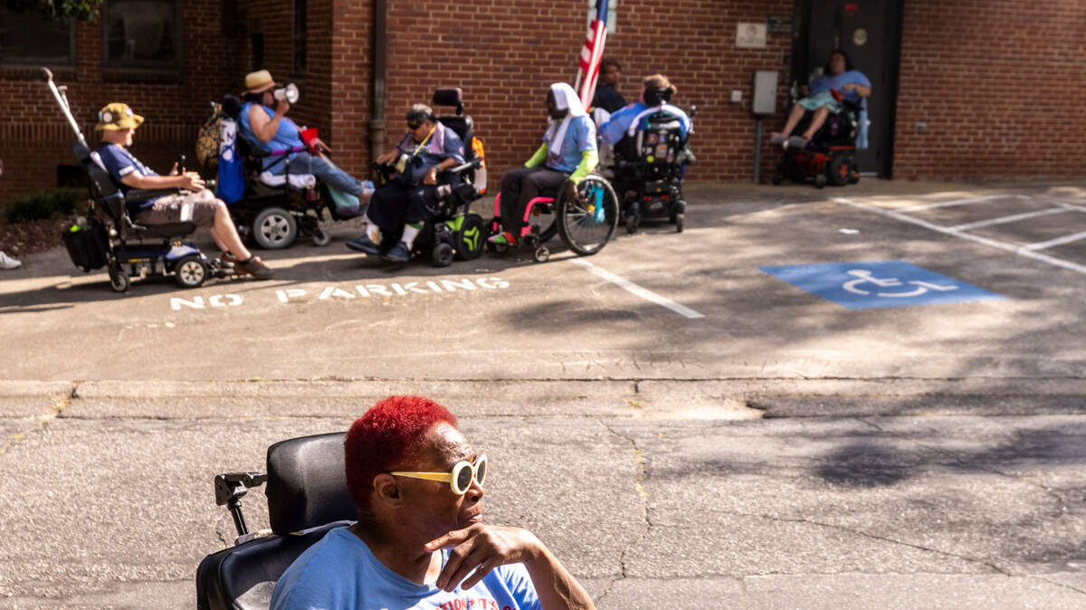 People in wheelchairs block exterior doors of the NC Department of Health and Human Services building in Raleigh at times chanting “I’d rather go to jail than to die in a nursing home.” Protesters with the National ADAPT organization demanded improved service and support and an opportunity to speak with NC DHHS Sec. Kody Kinsley. At around 6 p.m. police left the scene without arrests.