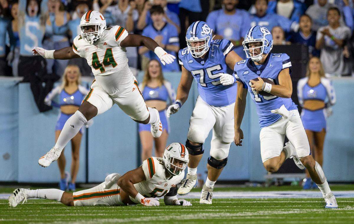 North Carolina quarterback Drake Maye (10) rushes for ten yards in the first quarter against Miami on Saturday, October 14, 2023 at Kenan Stadium in Chapel Hill, N.C.
