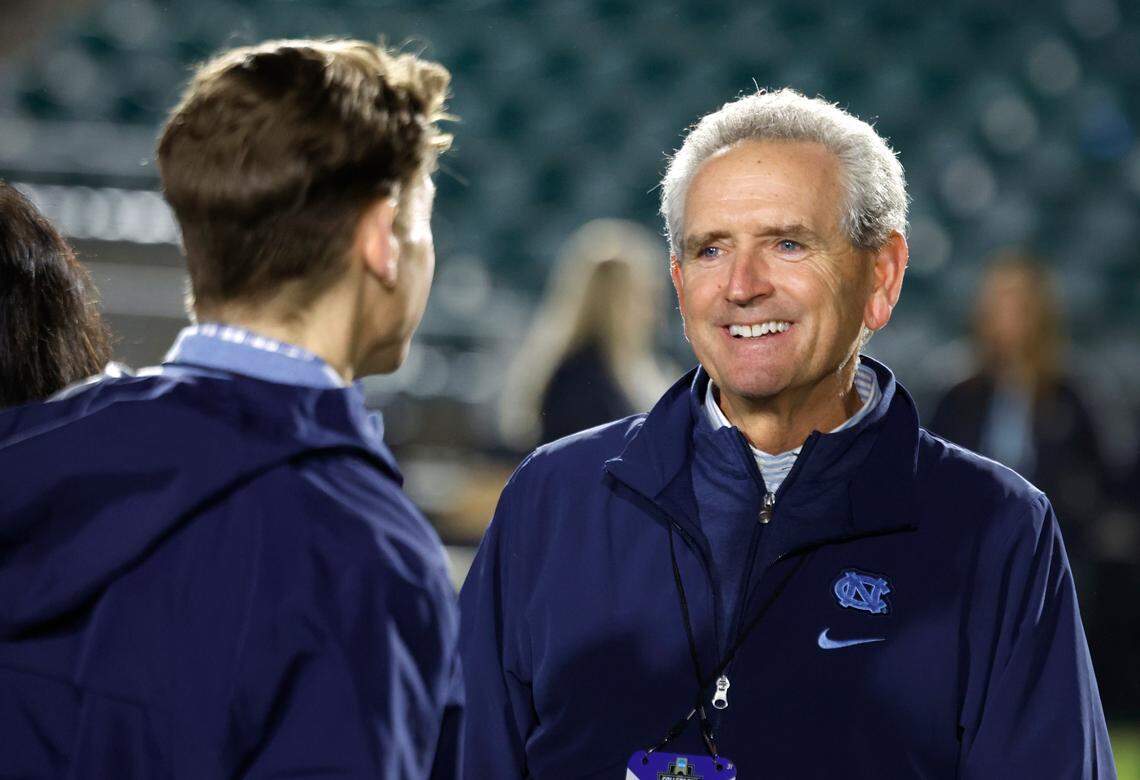 North Carolina athletics director Bubba Cunningham talks with Chancellor Lee Roberts after UNC’s 1-0 victory over Wake Forest in the finals of the 2024 Women’s College Cup at WakeMed Soccer Park in Cary, N.C., Monday, Dec. 9, 2024.