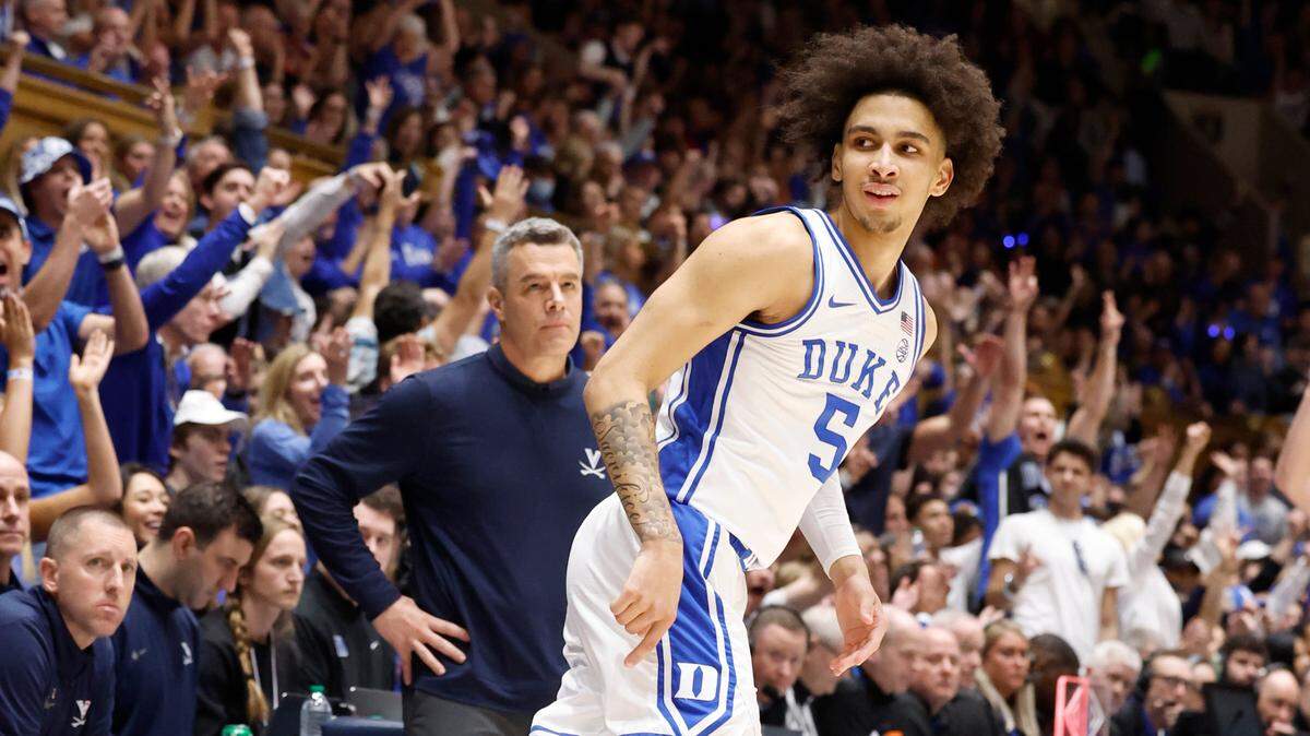 Duke’s Tyrese Proctor (5) looks back at the Virginia bench after hitting a three-pointer during the first half of Duke’s game against Virginia at Cameron Indoor Stadium in Durham, N.C., Saturday, March 2, 2024.