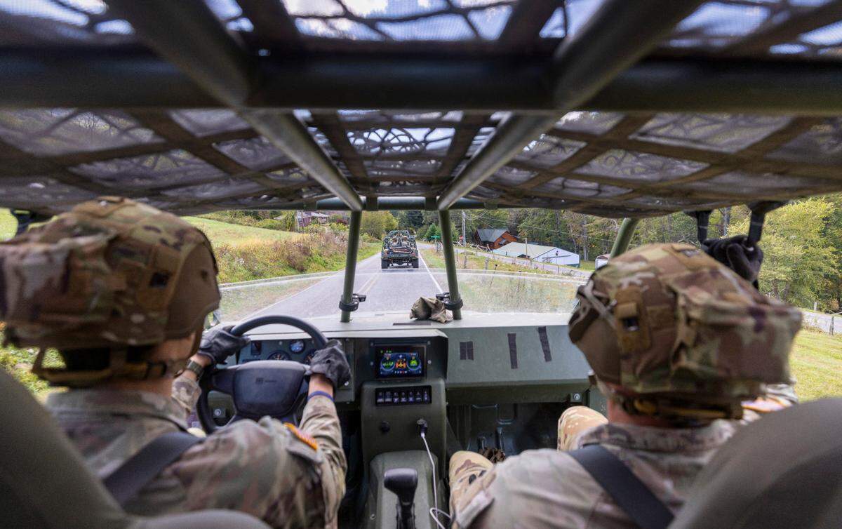 Soldiers with the 101st Airborne Division Air Assault, 2nd Brigade Combat Team, from Fort Campbell, Kentucky, use Infantry Squad Vehicles to deliver water, food, toiletries, and other aid to residents in the Soco Gap community in Maggie Valley on Tuesday, October. 8, 2024. The team has been using the Maggie Valley Pavilion and Town Hall as a distribution base for relief efforts in the town following Tropical Storm Helene.