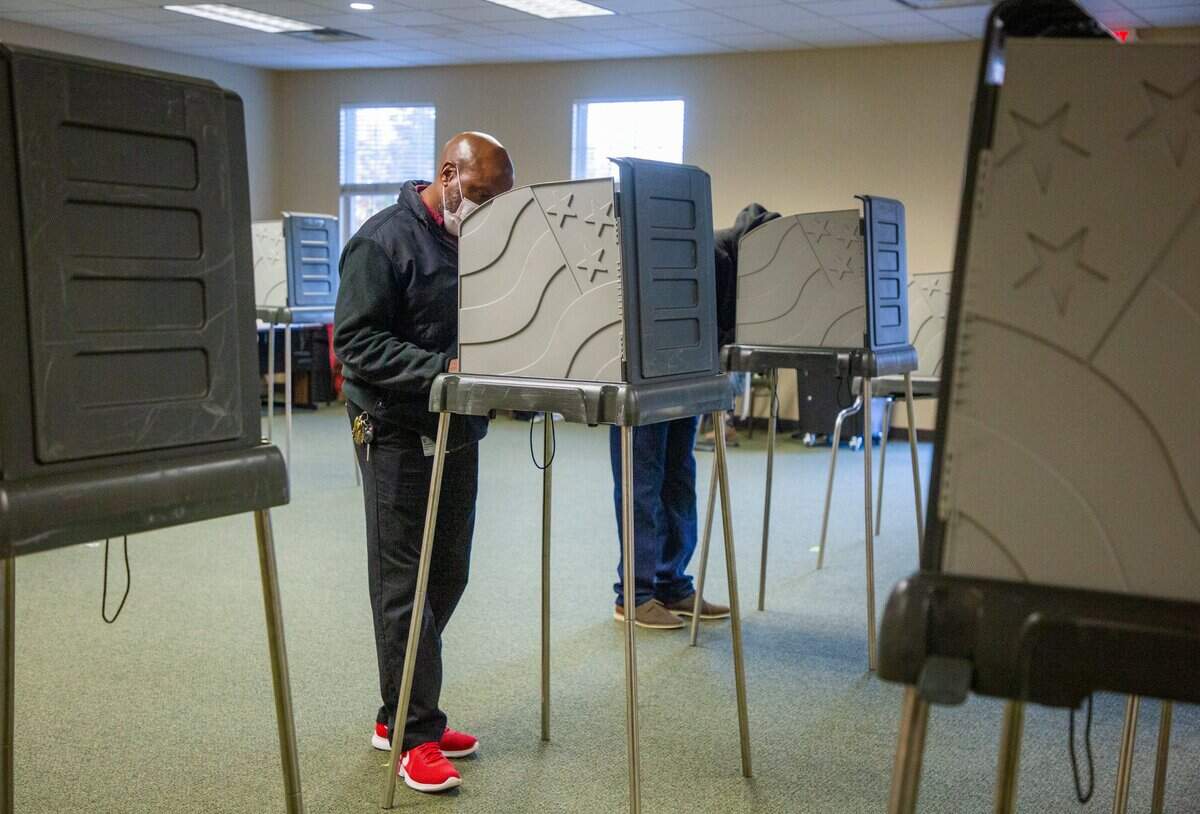 Kenneth Keith casts his ballot on Election Day at the Ivy Community Center, on Tuesday, Nov. 3, 2020, in Durham, N.C.