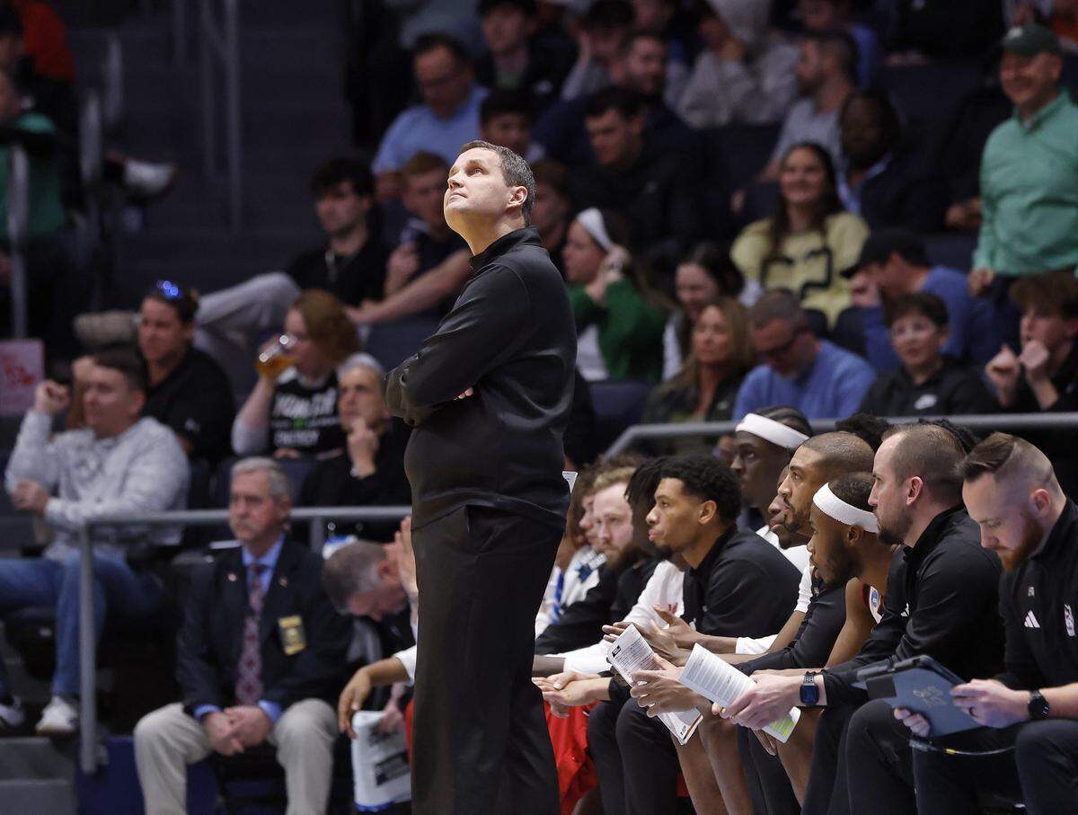 N.C. State head coach Will Wade looks at the scoreboard during the first half of the Wolfpack’s game against Texas during the NCAA First Four on Tuesday, March 17, 2026, at the University of Dayton Arena in Dayton, Ohio.