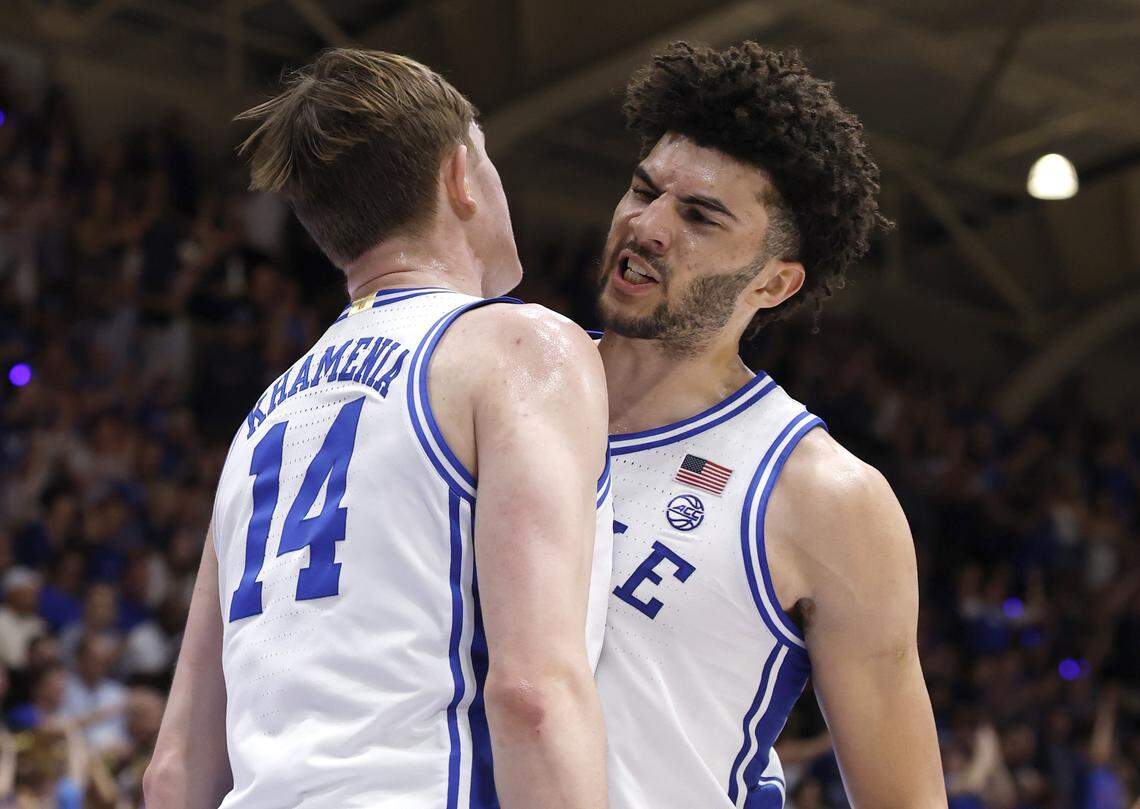 Duke’s Cameron Boozer (12) celebrates with Nikolas Khamenia (14) during the first half of Duke’s game against UNC at Cameron Indoor Stadium in Durham, N.C., Saturday, March 7, 2026.