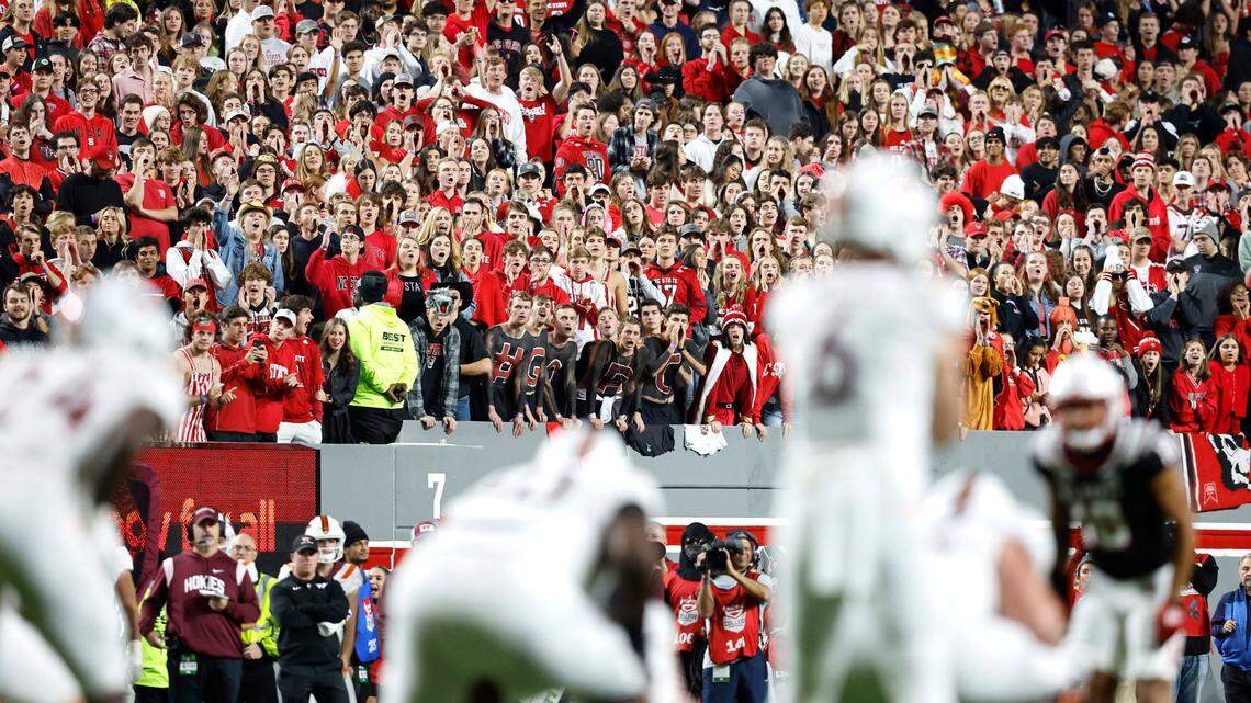Fans try to disrupt Virginia Tech during the first half of N.C. State’s game against Virginia Tech at Carter-Finley Stadium in Raleigh, N.C., Thursday, Oct. 27, 2022.