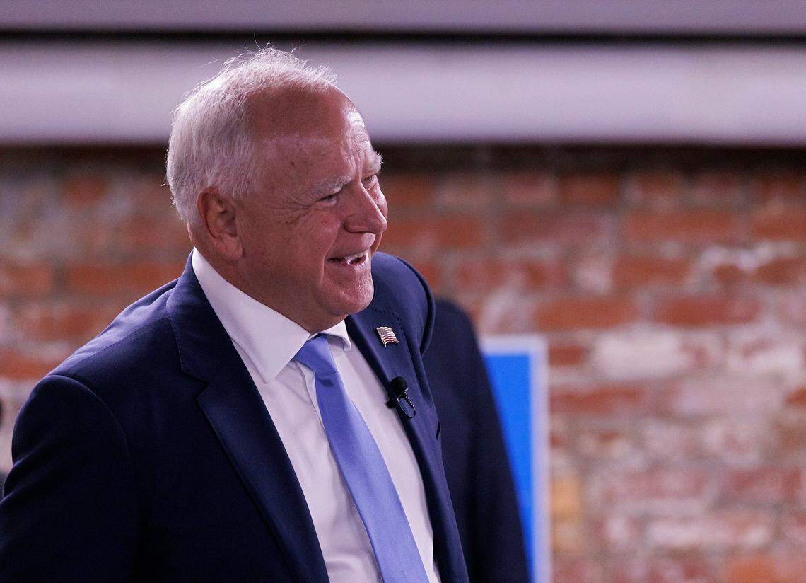 Democratic Vice Presidential nominee and Minnesota Gov. Tim Walz smiles while speaking with volunteers at a campaign office during a visit to Raleigh, N.C. on Thursday, Aug. 29, 2024.
