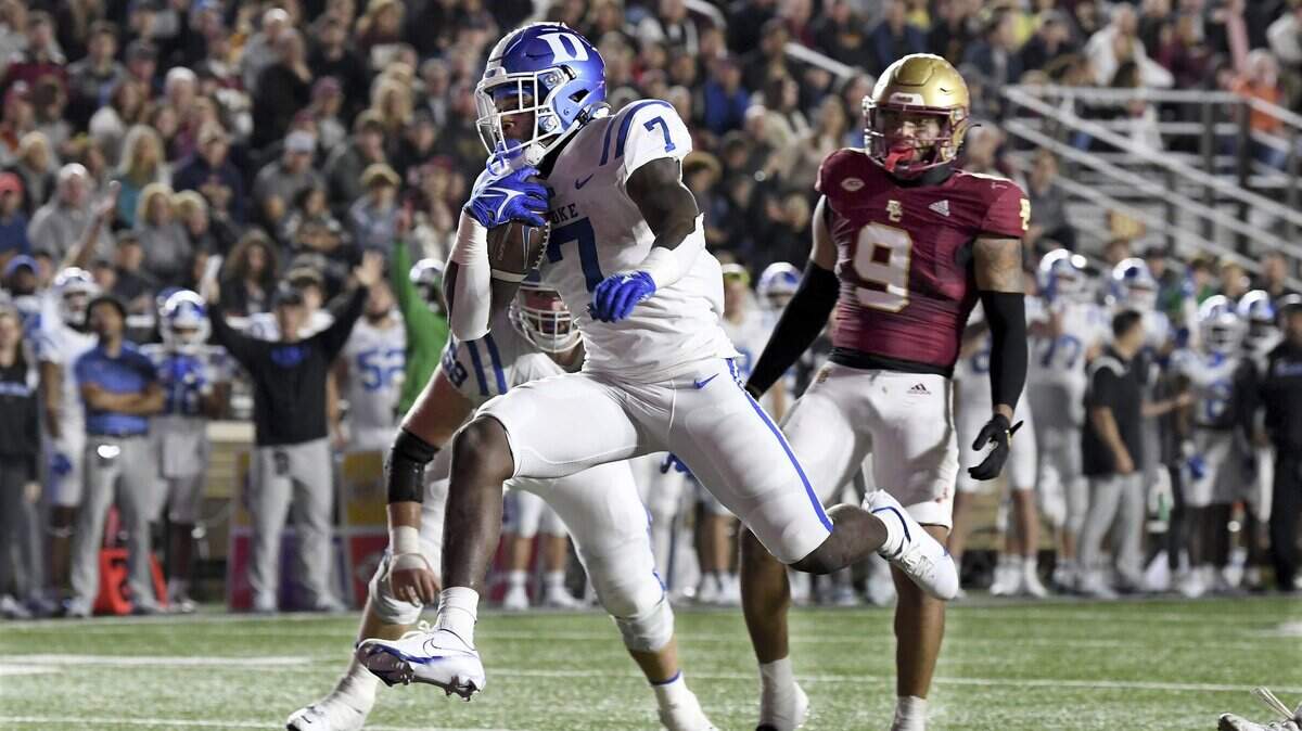 Duke runingback Jordan Waters (7) runs into the end zone to score during the first half of an NCAA college football game, Friday, Nov. 4, 2022 in Boston.