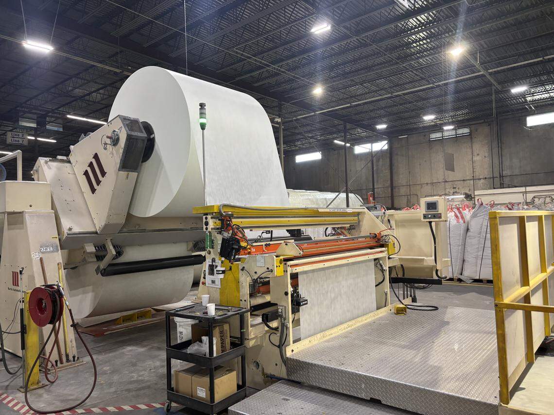 Fiberglass mat sheets being fed into the assembly line at Saint-Gobain’s CertainTeed shingles manufacturing plant in Oxford, N.C. on July 9, 2025.