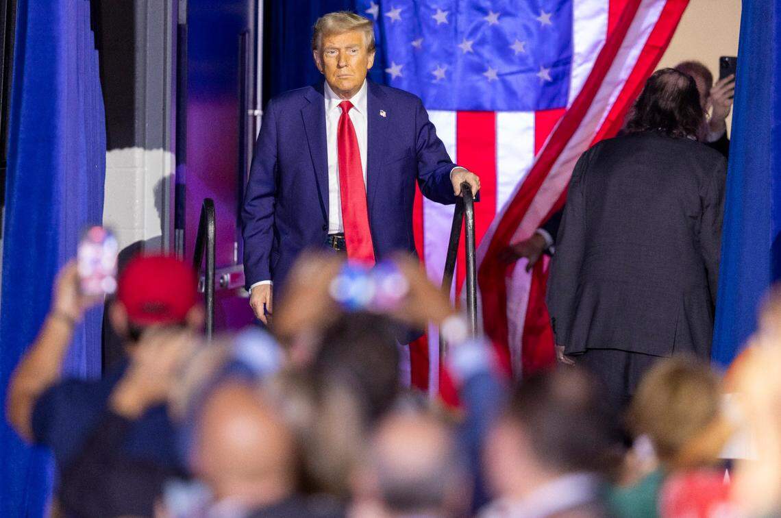 Former President Donald Trump takes the stage during a rally at Minges Coliseum in Greenville on Monday, Oct. 21, 2024. With two weeks until Election Day, Trump went on a three-city tour, in which Trump will also see the destruction caused by Hurricane Helene in Asheville and speak at a faith conference in Concord.