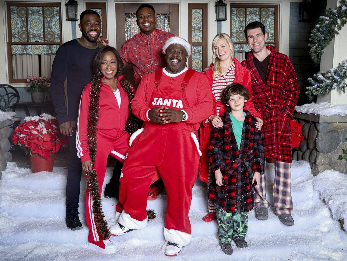 From the CBS show “The Neighborhood”: Sheaun McKinney, Tichina Arnold, Marcel Spears, Cedric the Entertainer, Beth Behrs, Hank Greenspan and Max Greenfield.