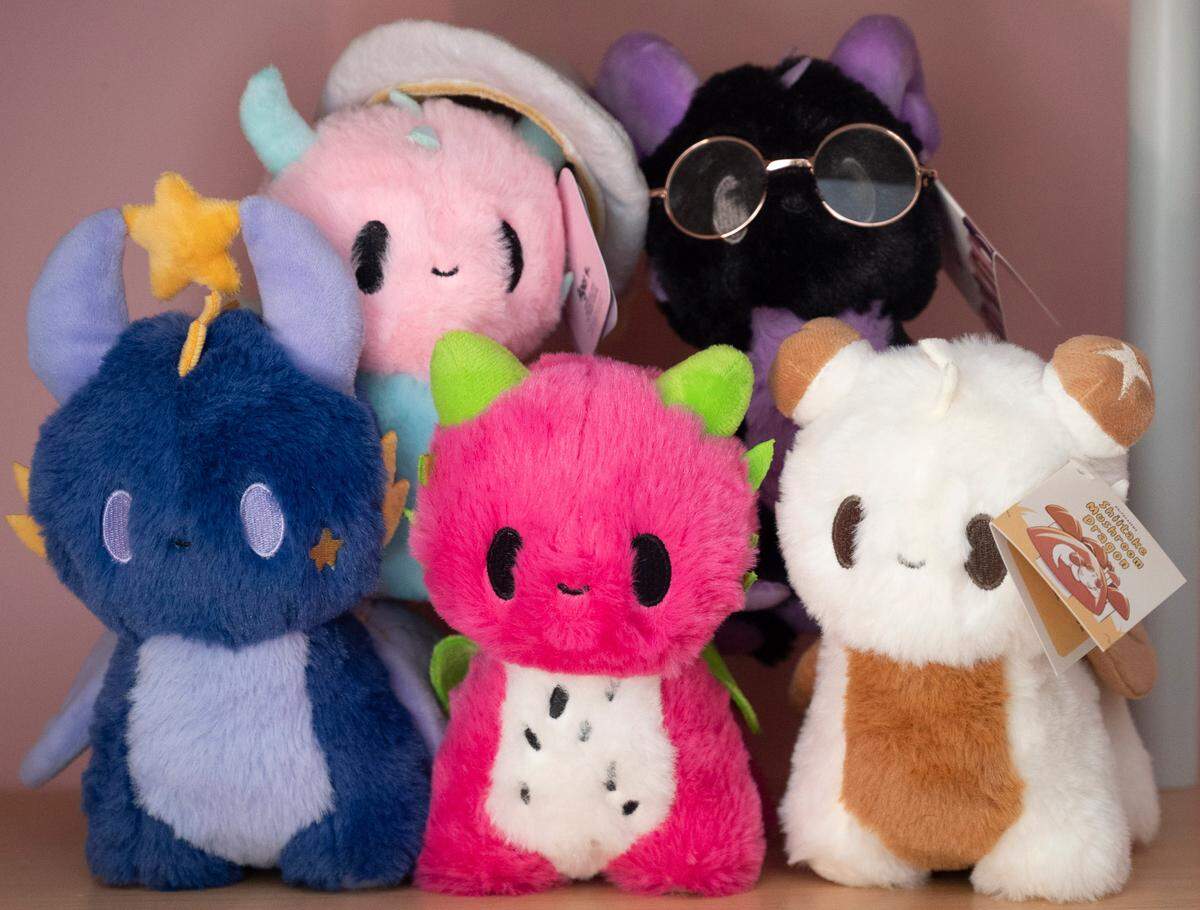 A collection of different dragon designs sit on a shelf in Emily Foster’s workspace in Raleigh on Monday, July 22, 2024.