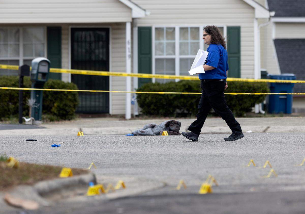 Law enforcement work the scene of a shooting on Sudbury Road in Durham, N.C. on Tuesday, Jan. 31, 2023.