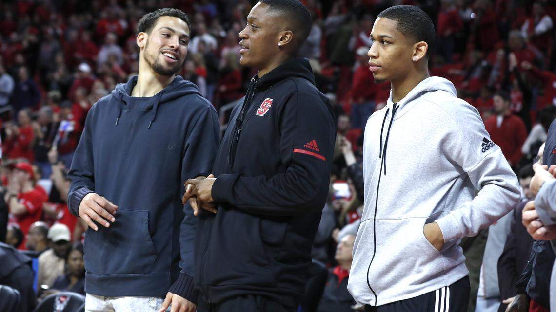 From left, N.C. State's Devon Daniels, C.J. Bryce and Blake Harris watch during the Wolfpack's 76-58 victory over Notre Dame at PNC Arena Saturday, Feb. 3, 2018.