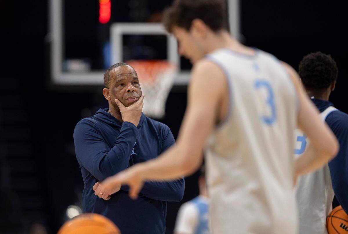 North Carolina coach Hubert Davis watches his players during their workout on Wednesday, March 20, 2024 as they prepare for the NCAA Tournament at Spectrum Center in Charlotte, N.C.