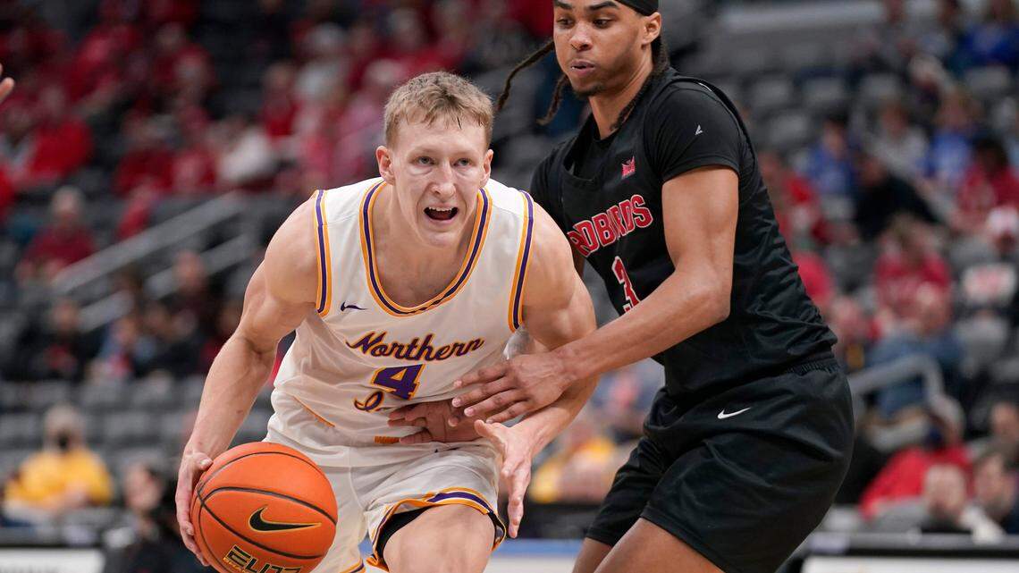 Northern Iowa’s AJ Green (4) heads to the basket past Illinois State’s Howard Fleming Jr. (3) in the quarterfinal round of the Missouri Valley Conference tournament March 4, 2022, in St. Louis.