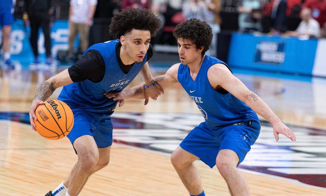 Duke’s Tyrese Proctor (5) drives around Spencer Hubbard (55) during Duke’s open practice at the Lenovo Center in Raleigh, N.C., Thursday, March 20, 2025. The Blue Devils will face Mount St. Mary’s in the first round of the NCAA Tournament Friday.