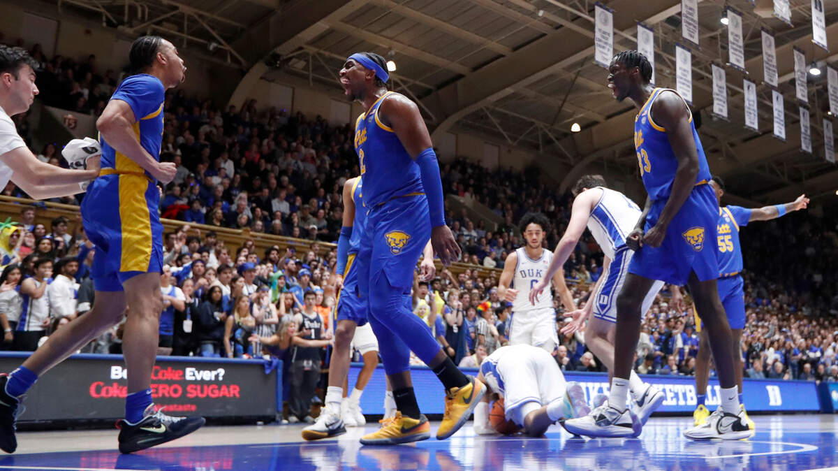 Pittsburgh’s Blake Hinson (2), center, celebrates with Ishmael Leggett (5), left, as Federiko Federiko (33) also celebrates after Leggett was fouled during Pitt’s 80-76 victory over Duke at Cameron Indoor Stadium in Durham, N.C., Saturday, Jan. 20, 2024.