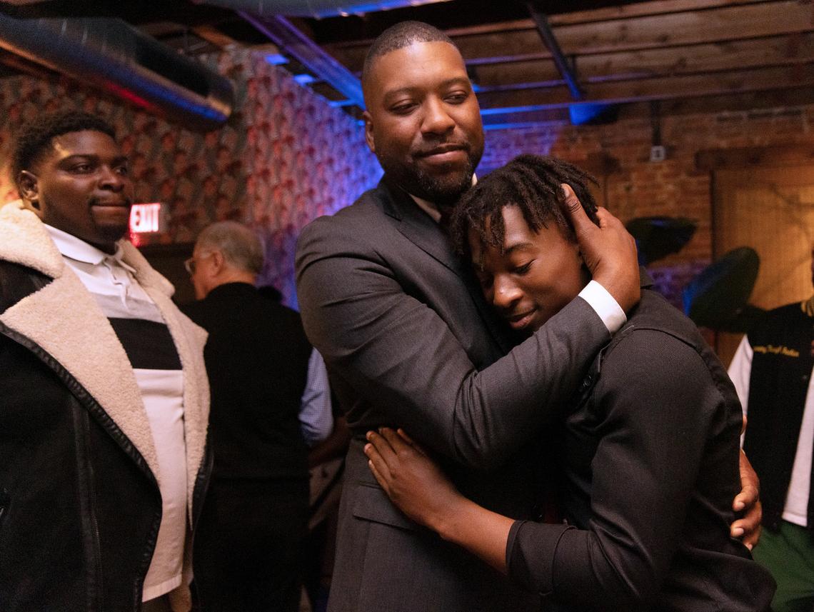 Durham mayor elect Leonardo Williams hugs his son, Izaiah, after celebrating his election victory with supporters at The Velvet Hippo on Tuesday, Nov. 7, 2023, in Durham, N.C.